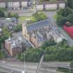 Oblique aerial view of St Mungo's Roman Catholic Church and Martyrs' Public School, looking W.