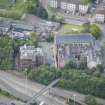 Oblique aerial view of St Mungo's Roman Catholic Church and Martyrs' Public School, looking WSW.