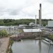 General view of Tullis Russell site from south(taken from roof of creper house). Administration Block (left) and ponds with brick chimney and disused Boiler House in background.In the foreground, Pump Station with screens. This plant pumps water upto the Water Filtration House