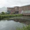 General view of Tullis Russell site from north west. East gables of Rothes No.1 Pulp House and Machine House and Creper area with Ponds in foreground
