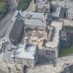 Oblique aerial view of Edinburgh Castle centred on the Palace Yard,  looking W.