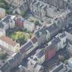Oblique aerial view of Chessel's Court and Canongate, looking SW.