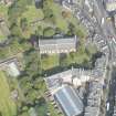 Oblique aerial view of Greyfriars Church and Churchyard, Greyfriars Place, Forrest Road and Candlemaker Row, looking N.