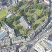 Oblique aerial view of Greyfriars Church and Churchyard, Greyfriars Place, Candlemaker Row and Magdalen Chapel, looking WNW.