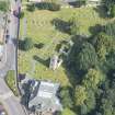 Oblique aerial view of St Kentigern's Church and Churchyard, looking NE.