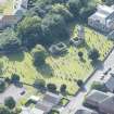 Oblique aerial view of St Kentigern's Church and Churchyard, looking SW.