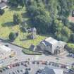 Oblique aerial view of St Kentigern's Church and Churchyard, looking ESE.