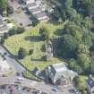 Oblique aerial view of St Kentigern's Church and Churchyard, looking E.