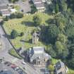Oblique aerial view of St Kentigern's Church and Churchyard, looking ENE.