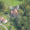 Oblique aerial view of Glencorse Parish Church, looking E.