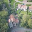 Oblique aerial view of Glencorse Parish Church, looking W.