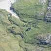 Oblique aerial view of buildings and enclosures on Pabbay, looking SSE.