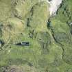 Oblique aerial view of buildings and enclosures on Pabbay, looking ESE.