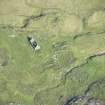 Oblique aerial view of buildings and enclosures on Pabbay, looking NE.