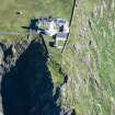 Oblique aerial view of Barra Head Lighthouse and the possible dun, looking E.