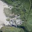 Oblique aerial view of Mingulay Township and St Columba's Chapel, looking SSE.