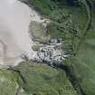 Oblique aerial view of Mingulay Township and St Columba's Chapel, looking SE.