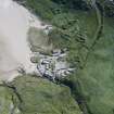 Oblique aerial view of Mingulay Township and St Columba's Chapel, looking ESE.