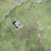 Oblique aerial view of Mingulay Chapel and Township, looking E.