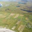 Oblique aerial view of Aird, looking E.