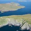 General oblique aerial view of Berneray with Mingulay beyond, looking NNE.