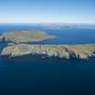 General oblique aerial view of Berneray with Mingulay beyond,  looking NNE.