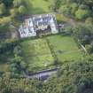 Oblique aerial view of Raasay House and walled garden, looking SSW.