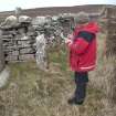 View of J R Sherriff recording the boundary stones , looking NW