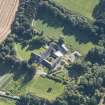 Oblique aerial view of Pluscarden Abbey, looking E.