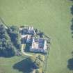 Oblique aerial view of Altyre House Stables, looking E.