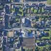 Oblique aerial view of Strathbogie Manse, TA Centre and Police Station, looking SSW.