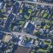 Oblique aerial view of Strathbogie Manse, TA Centre and Police Station, looking S.
