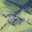 Oblique aerial view of Rothiemay House, Mains of Mayen, Mains of Rothiemay and Rothiemay Castle, looking NE.