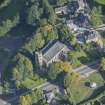 Oblique aerial view of St Rufus Church, looking N.