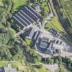 Oblique aerial view of Strathmill Distillery, looking NE.