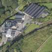 Oblique aerial view of Strathmill Distillery, looking NW.