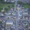 Oblique aerial view of St Thomas' Roman Catholic Church, Presbytery and Reidhaven Square, looking WNW.