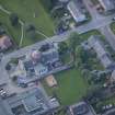 Oblique aerial view of St Thomas' Roman Catholic Church and Presbytery, looking SSW.