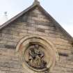 Detail of carved plaque on East elevation.