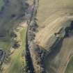 Oblique aerial view of the location of Stobs Camp railway siding and route of the Waverley Railway Line, looking S.