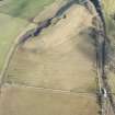 Oblique aerial view of the route of the Waverley Railway Line and Stobs Camp sidings, looking NNE.