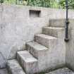 General view of steps onto the west gun pit wall showing small niche.