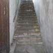 General view of oil store entrance steps from the entrance door looking west.