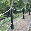 General view of original military metal gate posts along the entrance road.