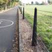 General view of original military metal posts along the entrance road.