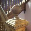 Detail of newel post at bottom of main staircase.