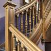 Detail of balustrade and newel post on main staircase.