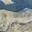 Oblique aerial view of the farmsteads and rig on the SW bank of the Shee Water, Glen Shee, looking SSW.