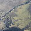 Oblique aerial view of the field system and rig and furrow to the SW of Spittal of Glenshee, looking SE.