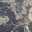 Oblique aerial view of an enclosure at Badkeirie in Glen Shee, looking SW.